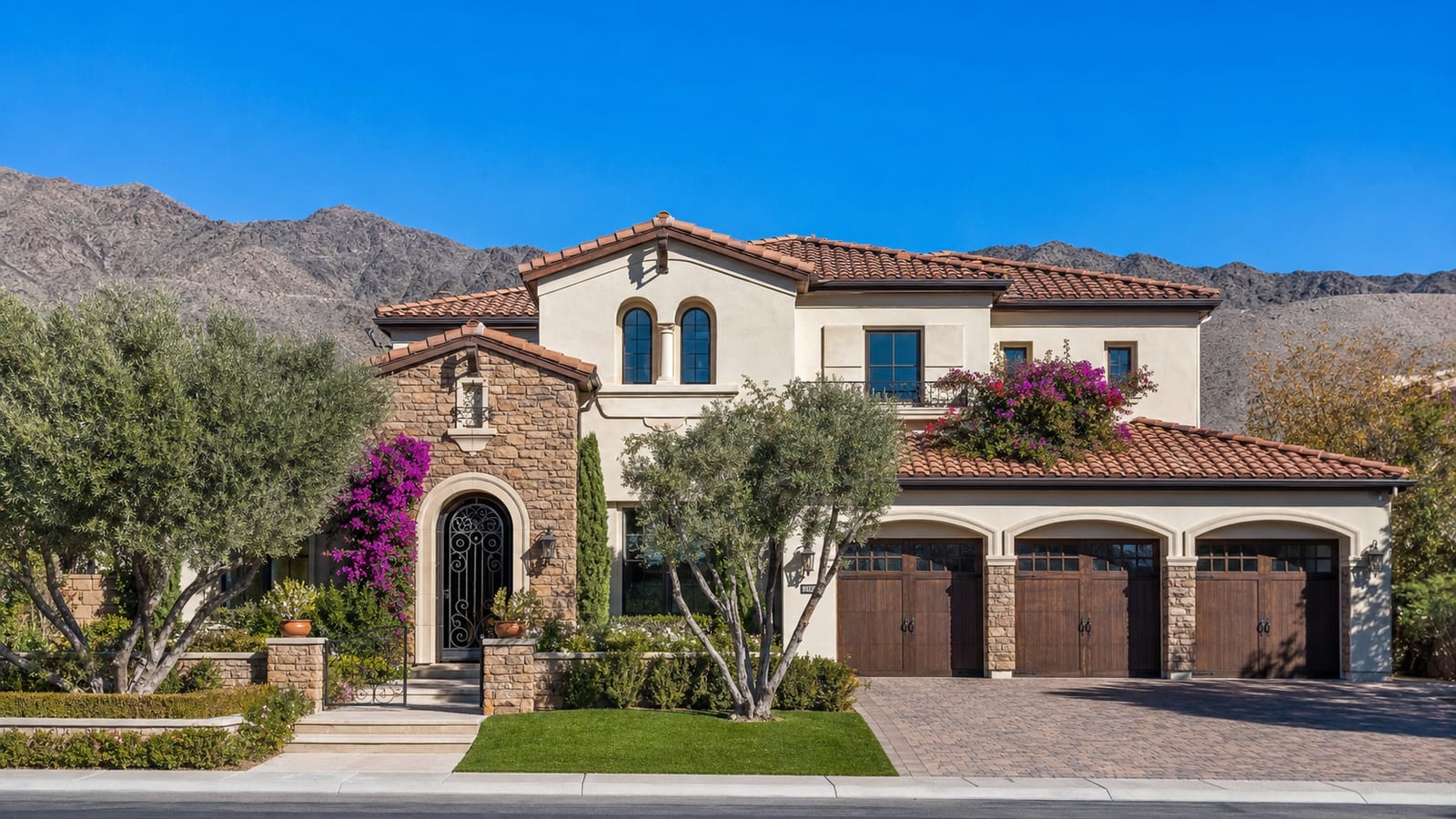 Tuscany Henderson Mediterranean single-family home exterior with terracotta tile roof and warm Tuscan stucco facade